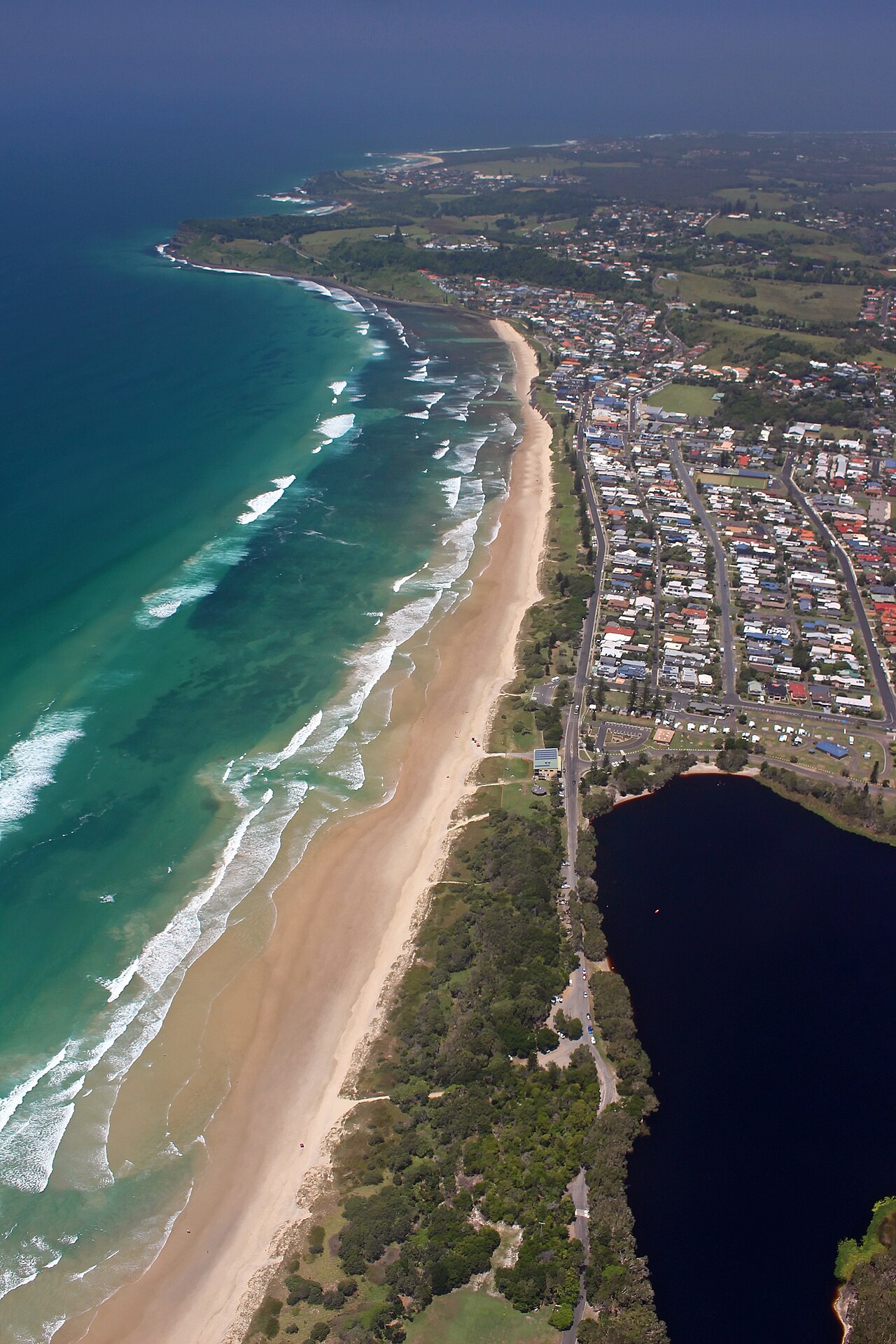 Aerial view of Seven Mile Beach and Lennox Head with Lake Ainsworth behind the dunes