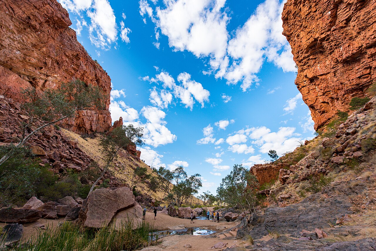 Walkers among the red rock walls of Simpsons Gap